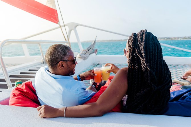 Aruba Sunset Sail with Caribbean Dinner and Live Music - Boarding behind the Hyatt and Barceló