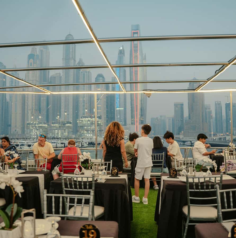 Dubai: Sunset or Dinner Cruise with Live Music & Open Bar - Assigned tables, upper-deck hopes, and photo strategy