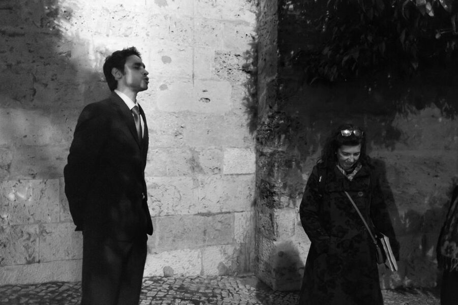 Fado: Musical Walking Tour with Food & Live Show - Hearing fado from a singer on the street