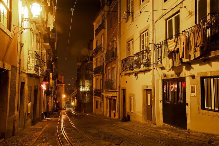 Lisbon: Fado Show with Dinner and City Tour - Alfama after sunset