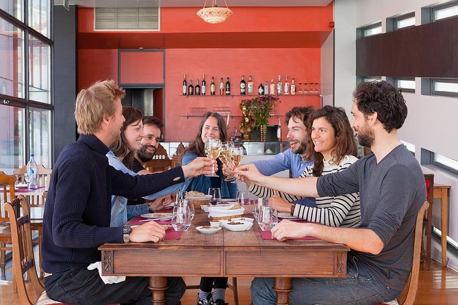 Lisbon Food Tour with 3 Stops and Fado Show Performance - Wine, cheese, and petiscos at the mercearia