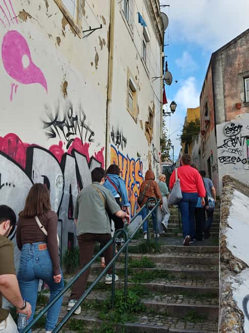 Multicultural Lisbon: Hidden Stories, Art, Food & Live Music - Climbing Graça for views and local snacks