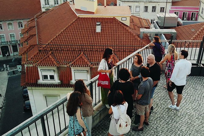 Private Tour: Lisbon Sunset Walking Tour with Fado Show and Dinner - Walking into Alfama after dark