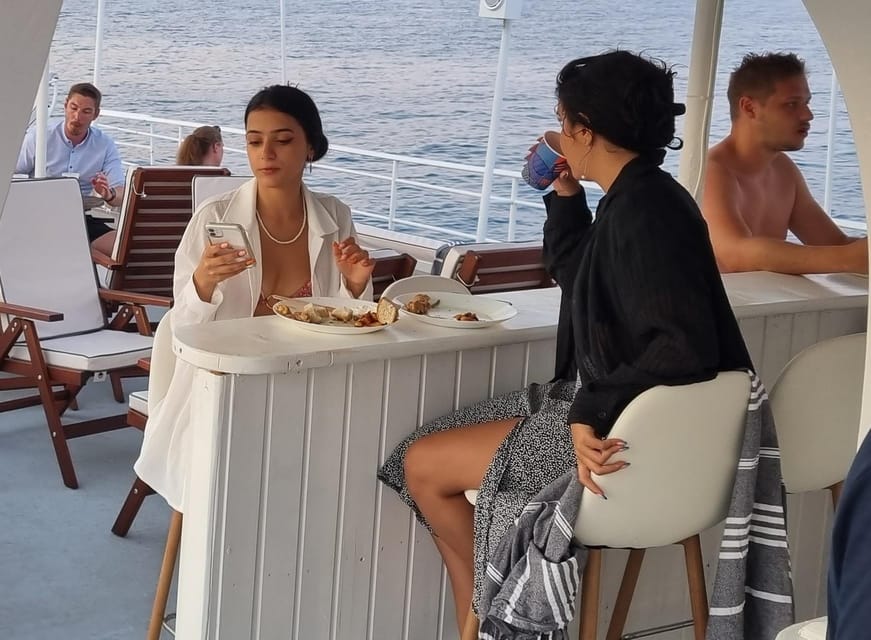Rhodes: Sunset Cruise with Live Music, Wine & Greek Buffet - Kallithea Bay is the active part of the evening