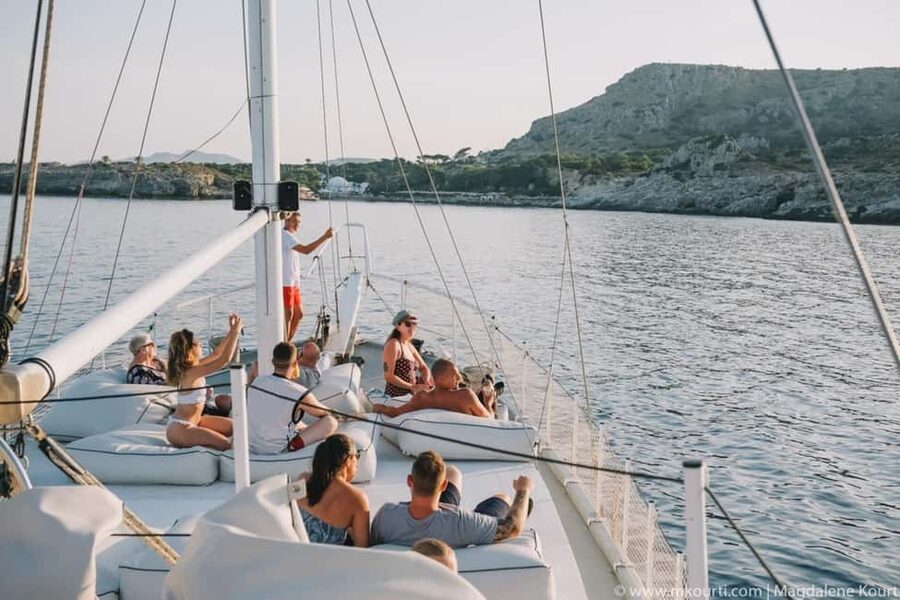Rhodes: Sunset Cruise with Open Bar, Dinner, & Live Music - Sunset, moonrise, and music on the way back