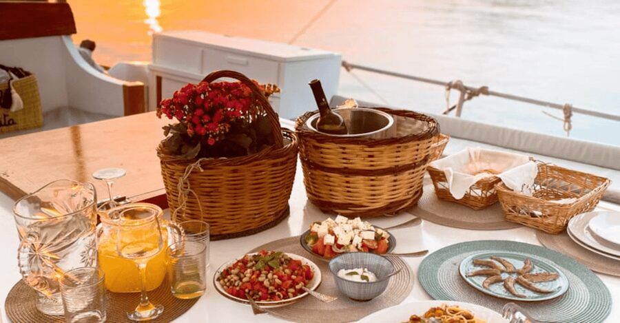 Rhodes: Sunset Cruise with Open Bar, Dinner, & Live Music - What to bring and how to plan the evening