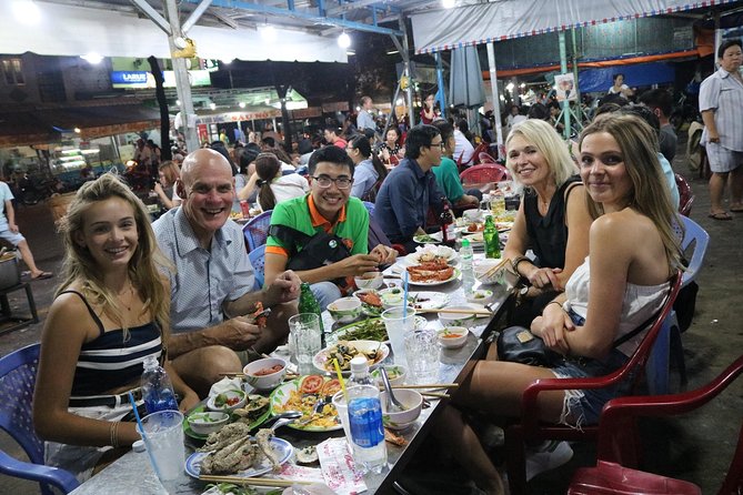 Saigon After Dark Vespa Street Food Tour + Live Music 4 hours - The first ride and seafood stop