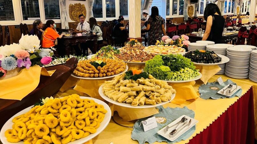 Saigon River Dinner on Cruise with Buffet and live music - Boarding as the sun gives way to city lights
