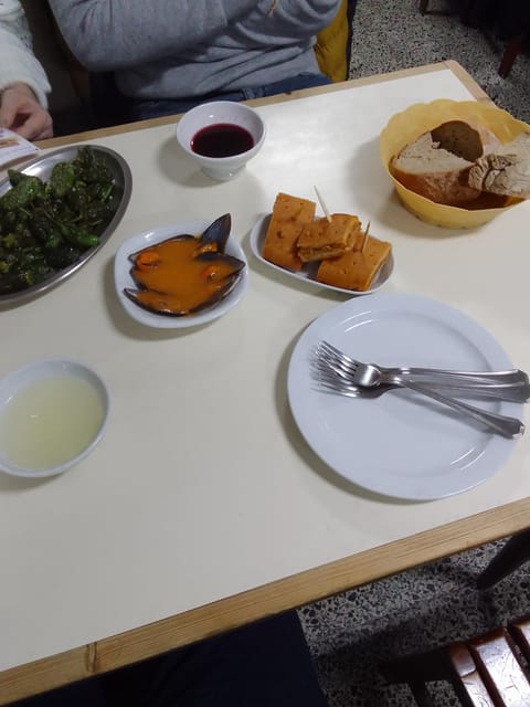 Santiago: Guided Foodie Tour with Drinks, Tapas & Live Music - The liqueur stop and the local angle