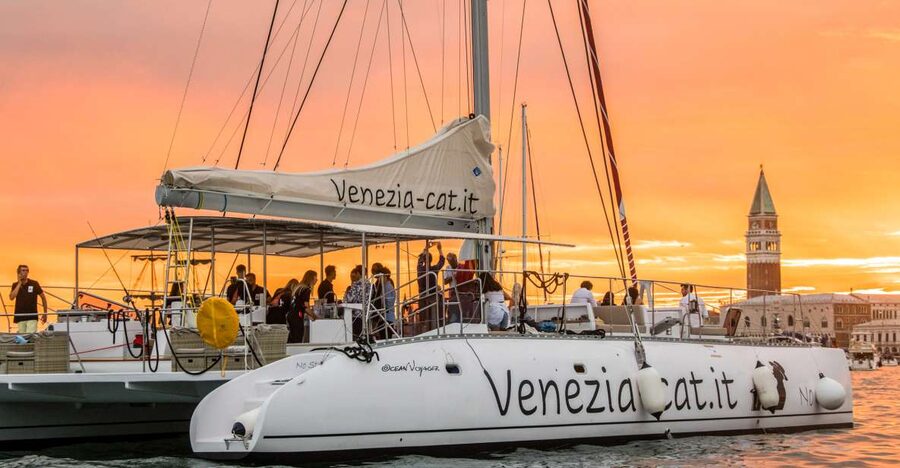 Venice: Catamaran Sunset Jazz Cruise with Aperitivo - Finding the red sails near Riva dei Sette Martiri
